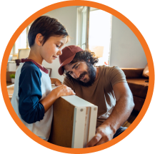 Father and son assembling a drawer